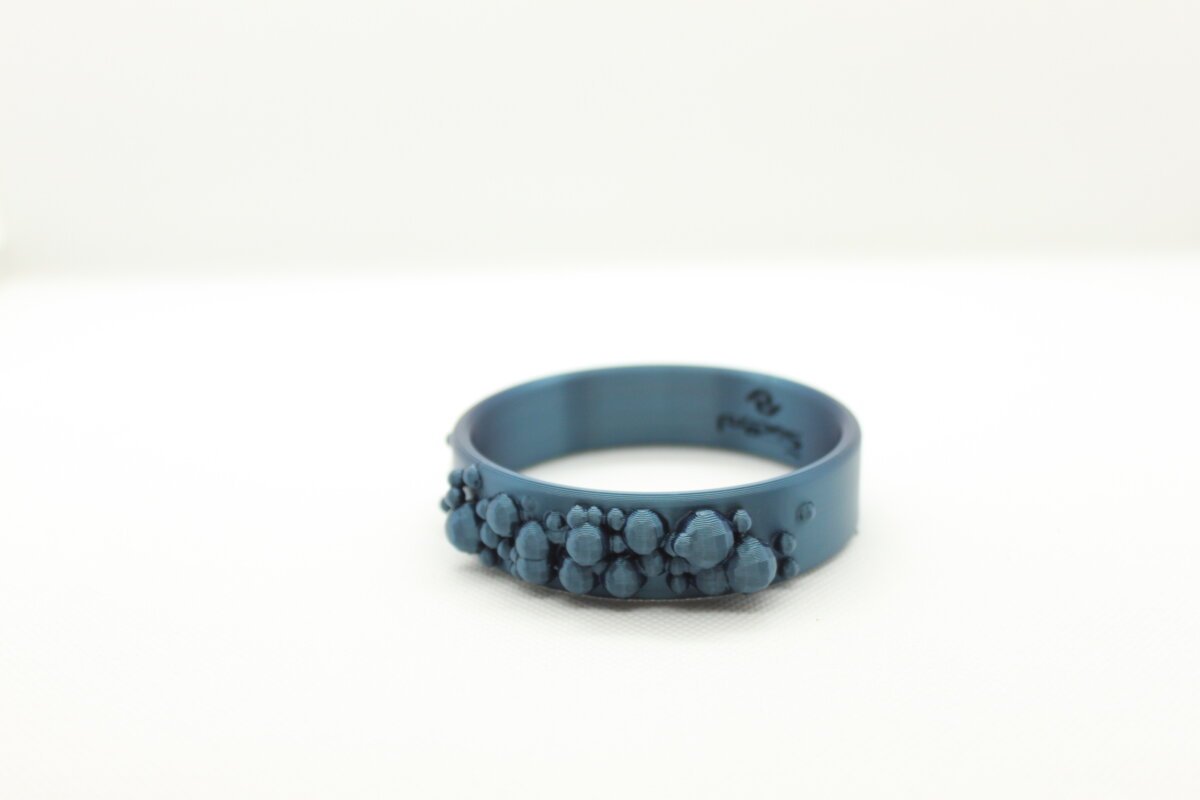 pulsera impresa en 3D color cian